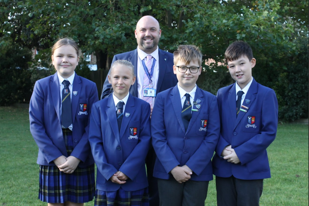 Mr Simon Marshall (Headteacher) with the Head Boy/Girl and Deputy Head Boy/Girl